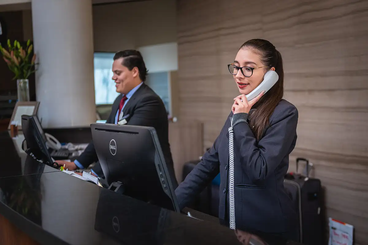 Hotel reception team assisting international guests in Gran Canaria